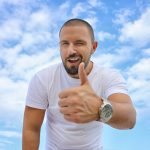 young man, blue sky, thumbs up-2939344.jpg